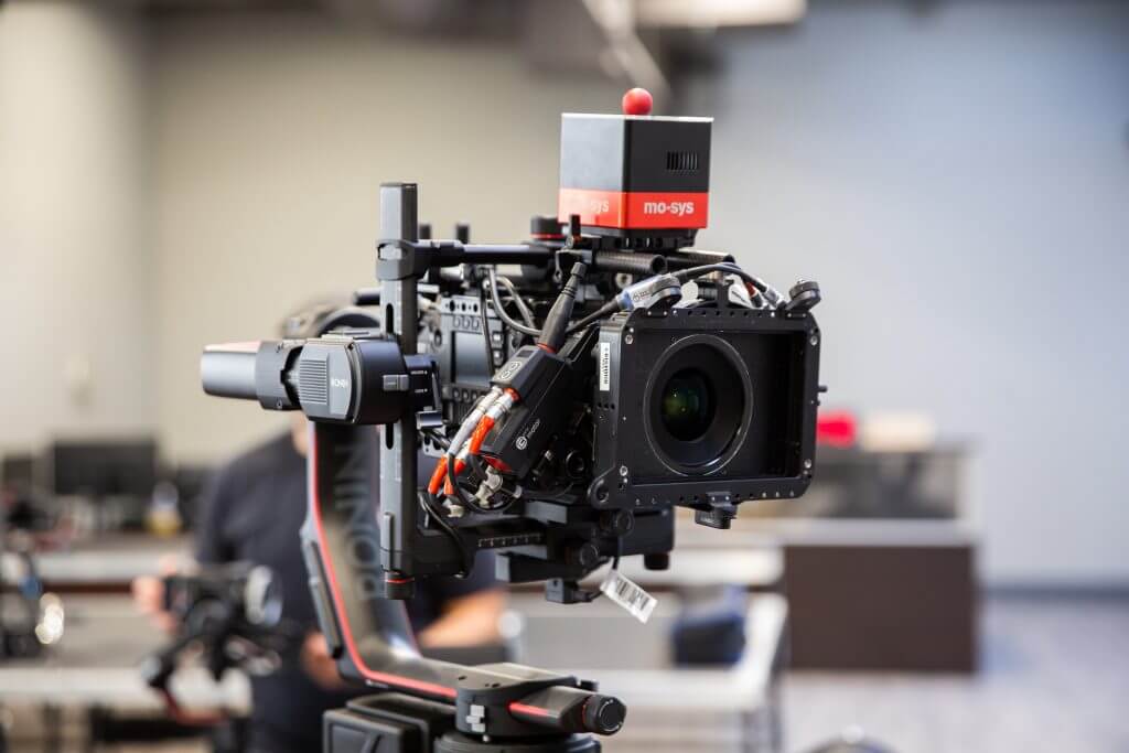 FX Productions Canada A professional video camera with a mo-sys remote head and various cables is mounted on a stabilizing rig in an indoor studio setting at FX Productions Canada, a leading Toronto Video Production company. Toronto Video Production Company