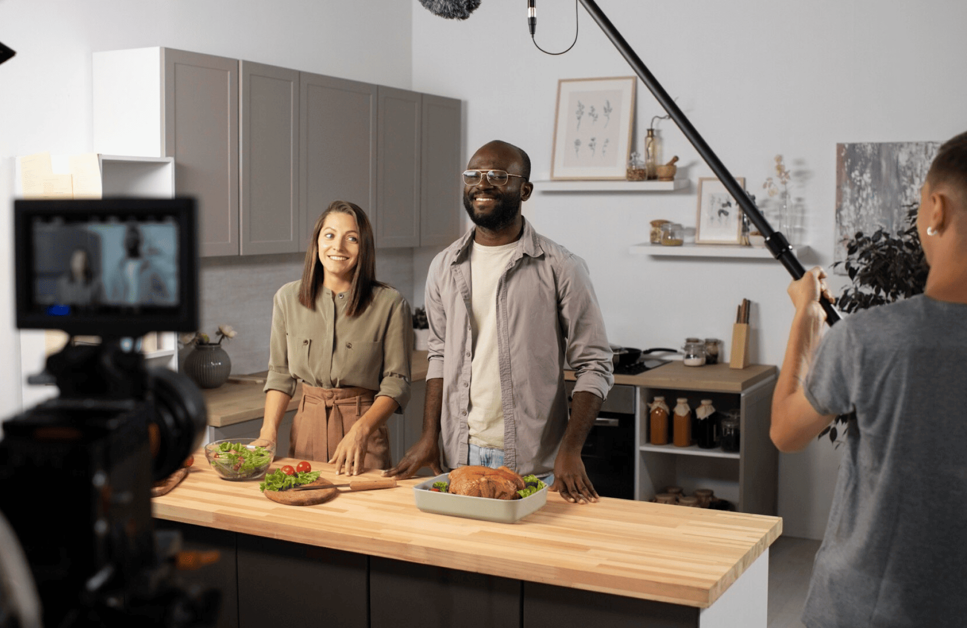 FX Productions Canada Two people stand behind a kitchen counter with food as a video crew from Toronto Production Company films them using a camera and boom microphone. Toronto Video Production Company