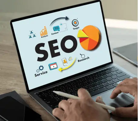 FX Productions Canada A person uses a laptop displaying an SEO diagram with keywords like analysis, content, and research, plus icons and a pie chart—perfect for a Toronto Video Production company or FX Productions Canada looking to optimize their digital strategy. Toronto Video Production Company