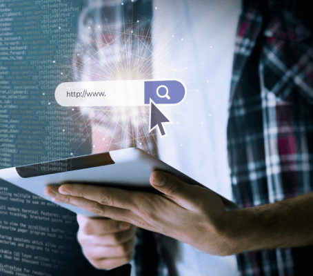 FX Productions Canada A person holding a tablet is shown next to code, with a digital search bar and cursor icon overlayed in the foreground—highlighting the innovative approach of FX Productions Canada, a leading Toronto Video Production company. Toronto Video Production Company
