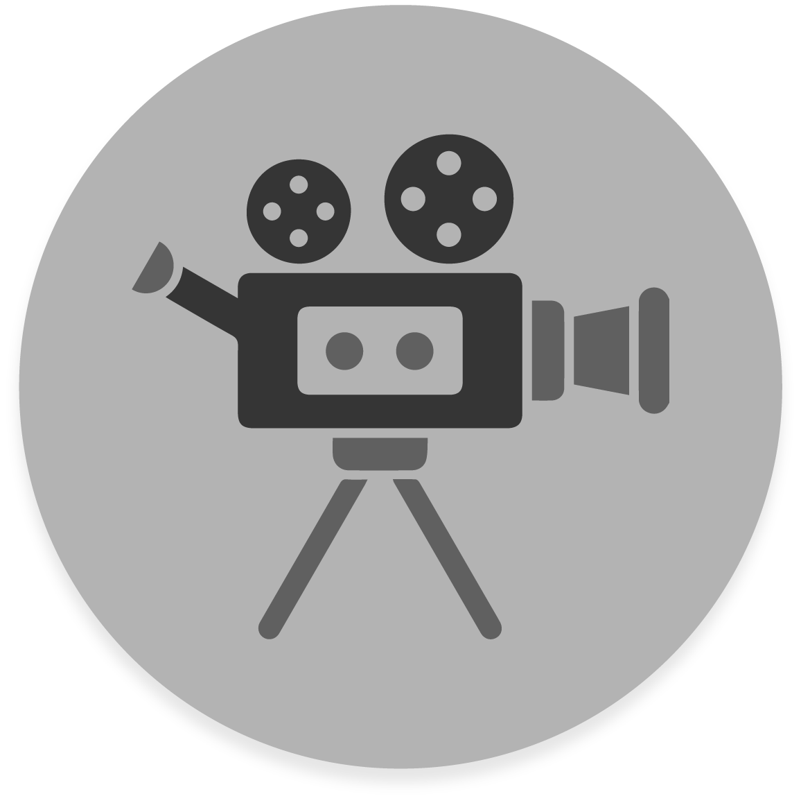 FX Productions Canada Icon of a vintage film camera with two reels on a tripod, displayed in dark gray on a circular background—perfect for representing a Toronto Production Company or FX Productions Canada. Toronto Video Production Company