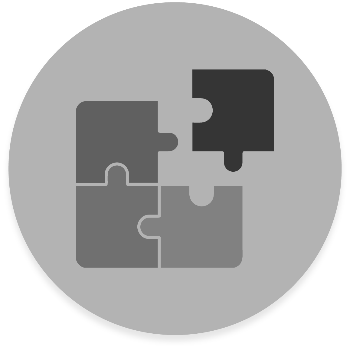 FX Productions Canada A dark circular icon with four interlocking puzzle pieces, three in medium gray and one darker, arranged in a square—perfect for representing FX Productions Canada, a leading Toronto Production Company. Toronto Video Production Company