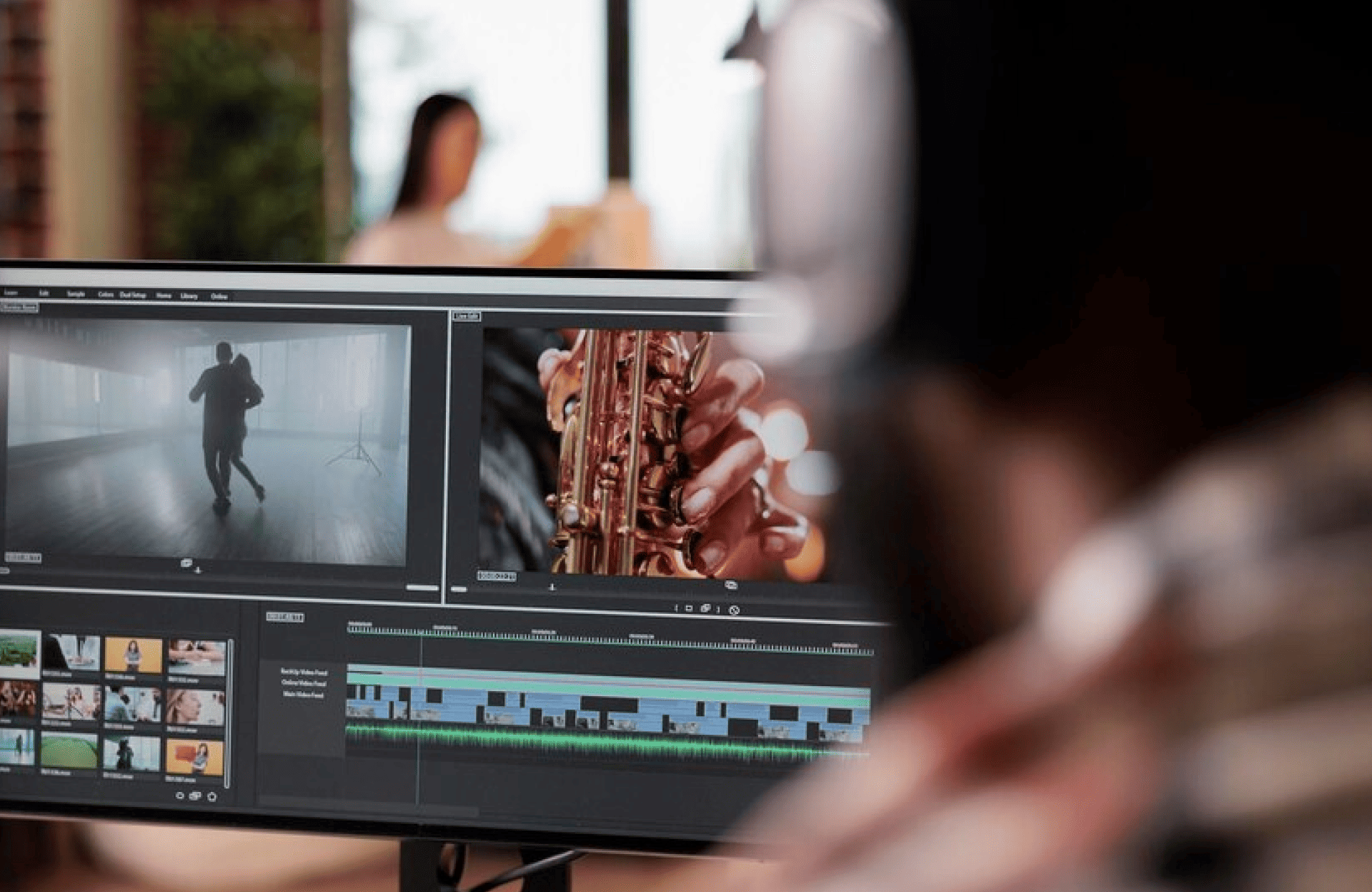 FX Productions Canada A person edits a video on a computer screen, showing footage of a dancer and a saxophone, with editing software and timelines visible—capturing the creative workflow at FX Productions Canada. Toronto Video Production Company