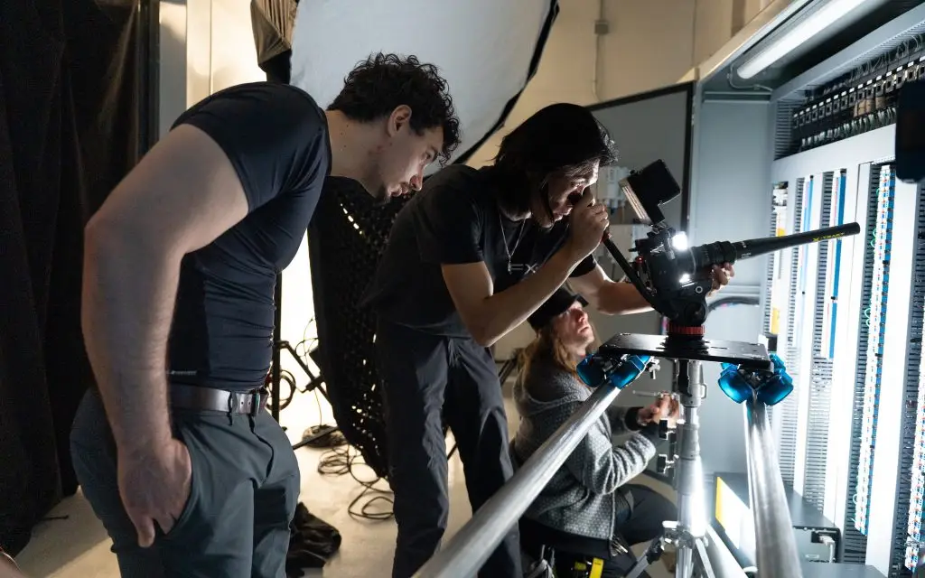 FX Productions Canada crew operating a camera slider rig with softbox lighting during an on-location video production shoot