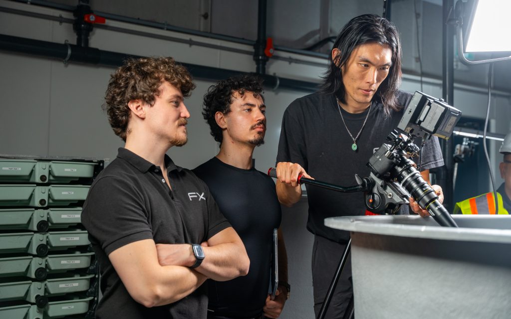 FX Productions Canada crew reviewing cinema camera setup on industrial video shoot location in Toronto