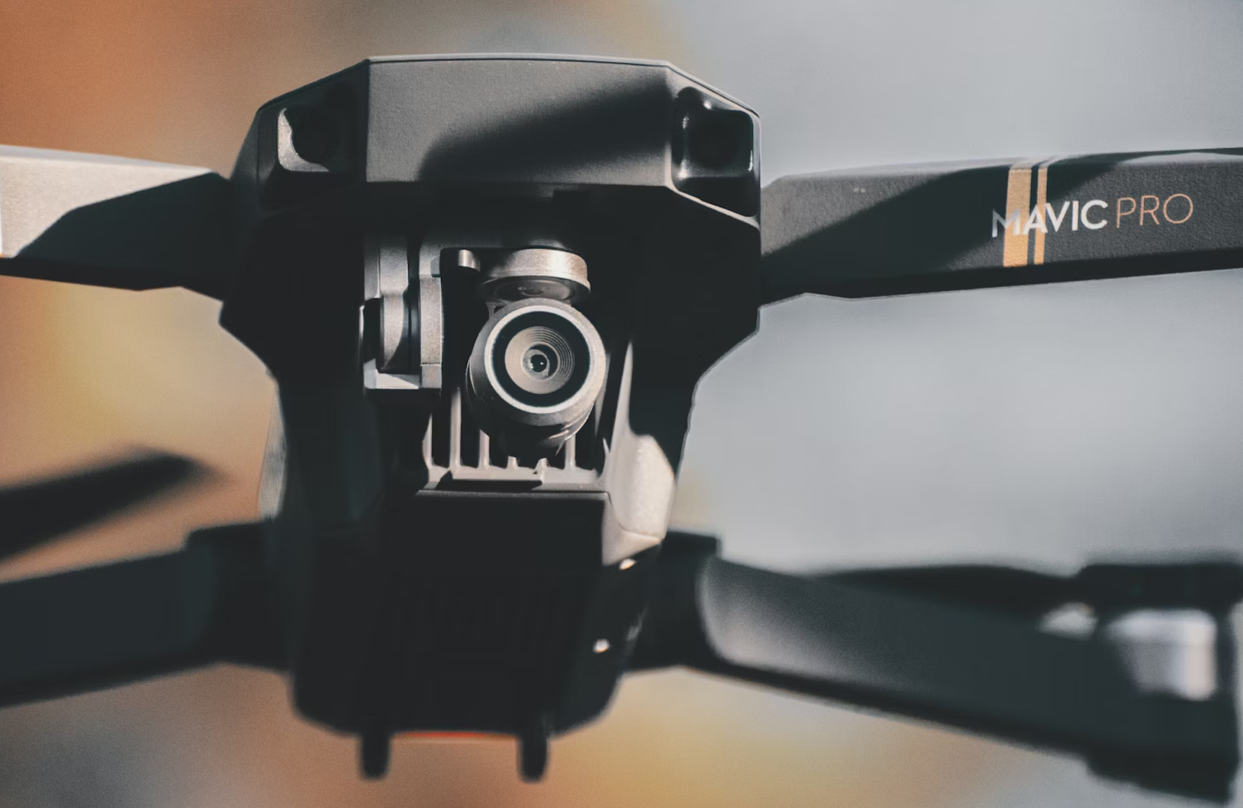 FX Productions Canada Close-up view of the camera and front arms of a DJI Mavic Pro drone, highlighting features ideal for aerial cinematography—perfect for operators with RPAS certification. The lens faces directly at the viewer. Toronto Video Production Company