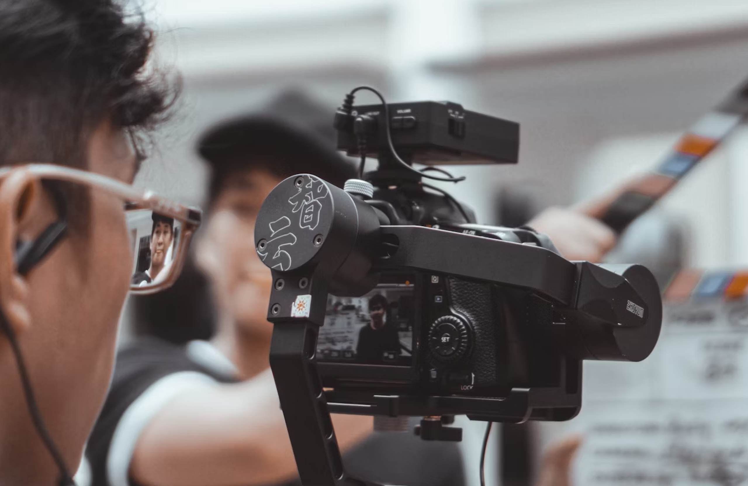 FX Productions Canada A camera with a person's reflection. Toronto Video Production Company