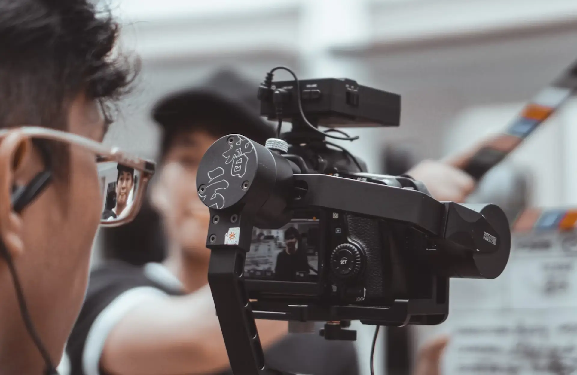 FX Productions Canada A camera with a person's reflection. Toronto Video Production Company