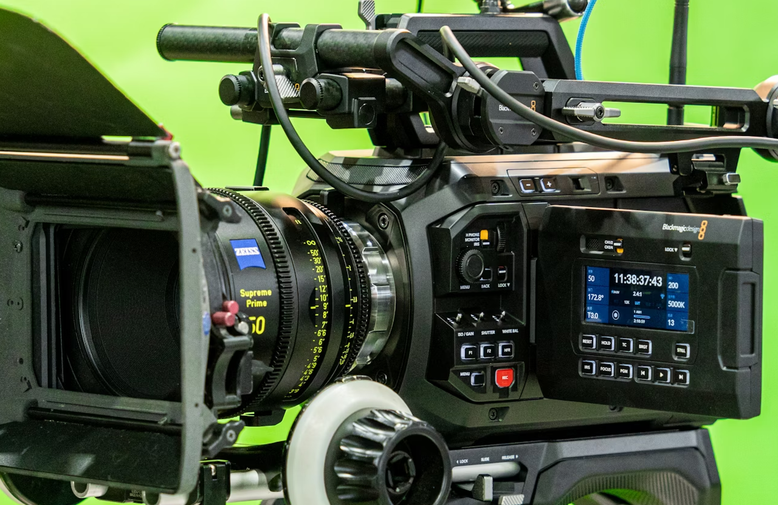 FX Productions Canada A professional video camera with a large cinema lens and digital display is set up against a green screen background, ideal for any corporate video project. Toronto Video Production Company