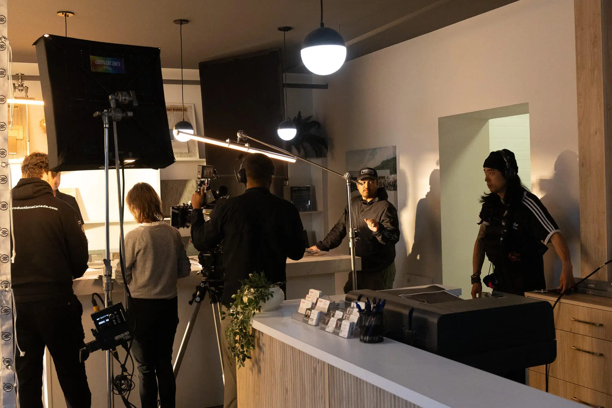 Event photography crew filming a live event with professional cameras and lighting equipment