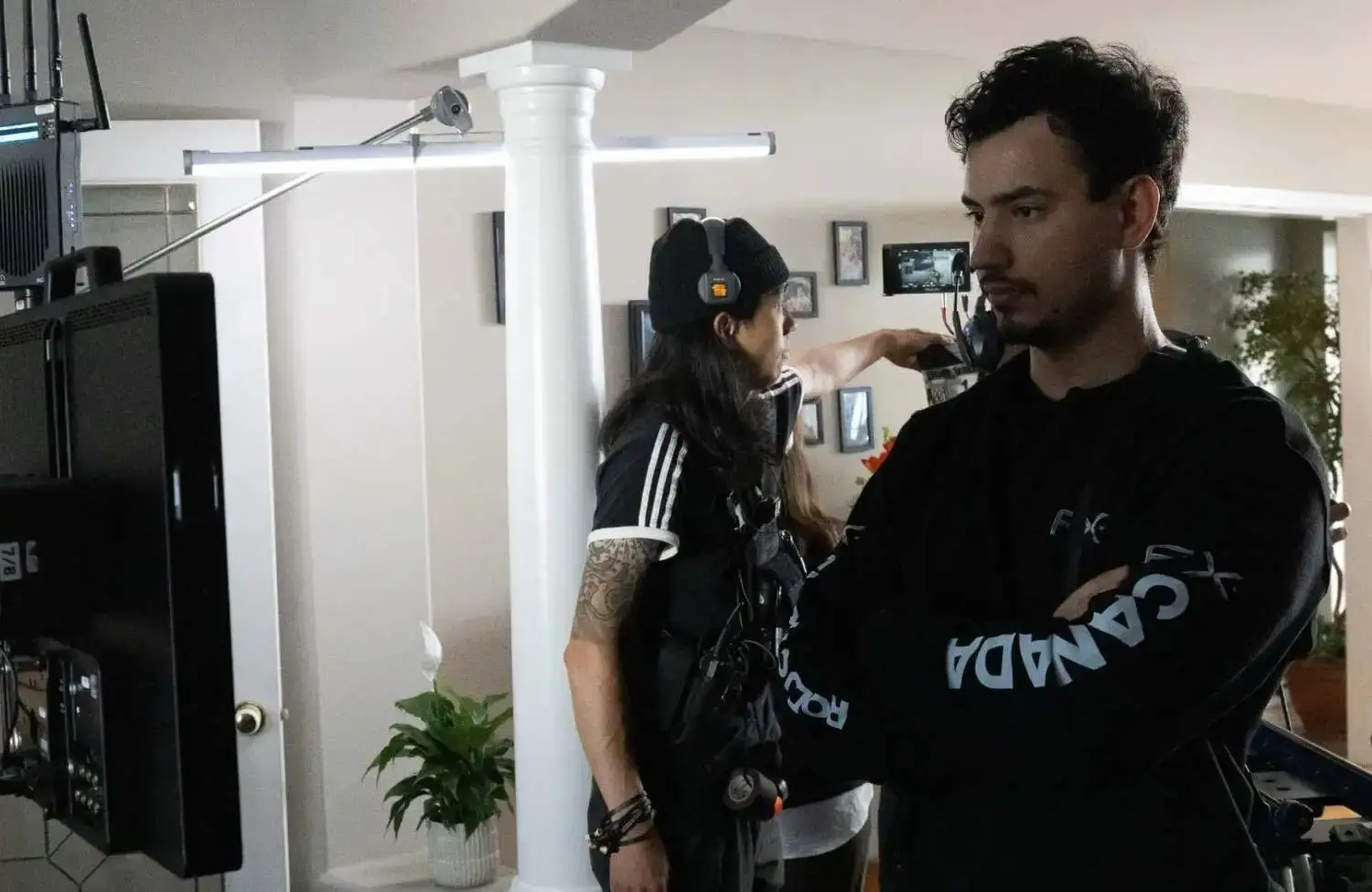 FX Productions Canada A film crew at work in a house, using a camera rig and monitor to follow a checklist to evaluate a video production vendor. Toronto Video Production Company