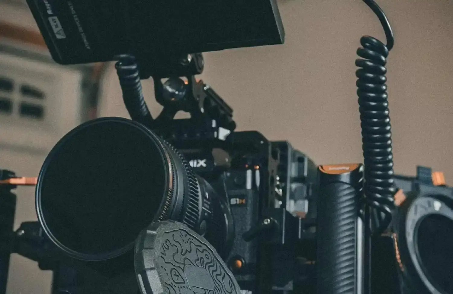 FX Productions Canada A professional cinema camera rig with a lens, monitor, and coiled cable used to compare video production rates and packages. Toronto Video Production Company